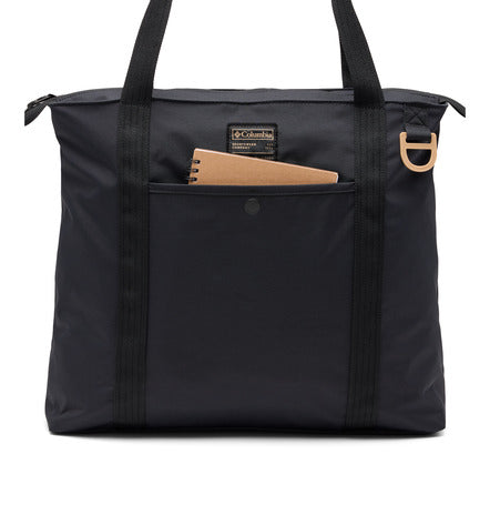 Black tote bag with a pocket containing a notebook on a white background