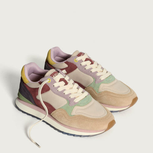 Multicolored sneakers on a light gray background