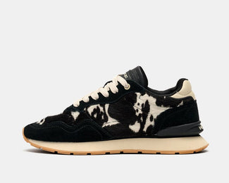 Black sneaker with white sole on a white background