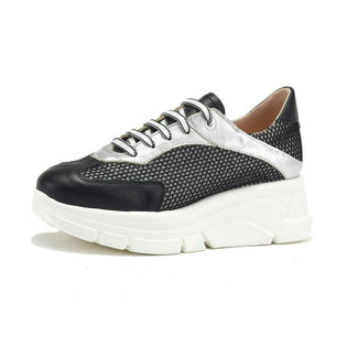 Black and white sneaker with a thick sole on a white background