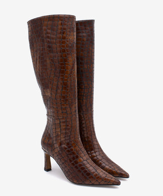 Brown knee-high boot with crocodile pattern on a white background