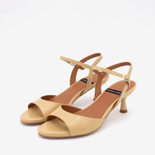Load image into Gallery viewer, Pair of beige high-heeled sandals on a white background
