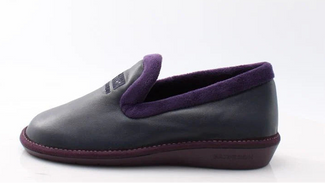 navy slipper with purple lining on a white background