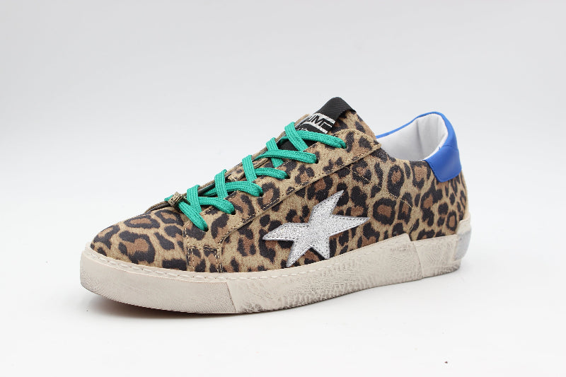 Leopard print sneaker with green laces on a white background