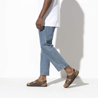 Brown sandal with cork sole on a white background