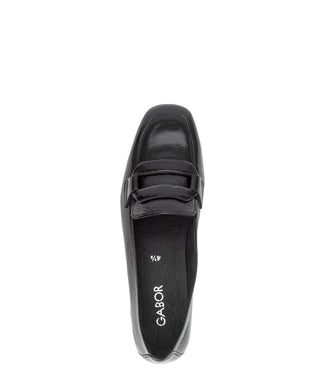 Black loafer shoe on a white background