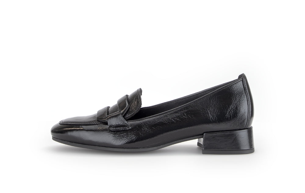 Black loafer shoe on a white background