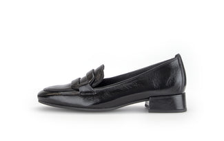 Black loafer shoe on a white background
