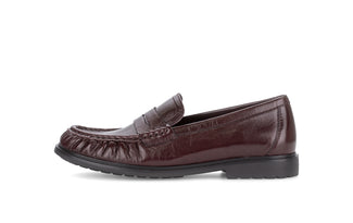 Burgundy leather loafer shoe on a white background