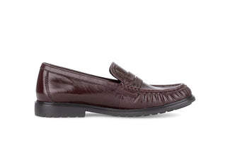 Burgundy leather loafer shoe on a white background