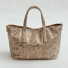 Load image into Gallery viewer, Metallic zebra-patterned handbag on a white background
