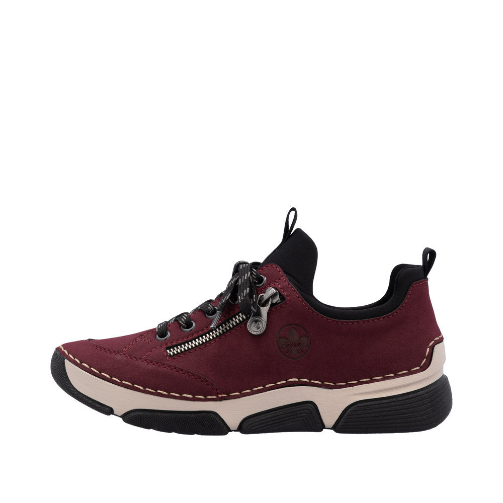 Maroon sneaker with black accents on a white background