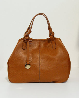 Brown leather handbag with a gold clasp on a light gray background