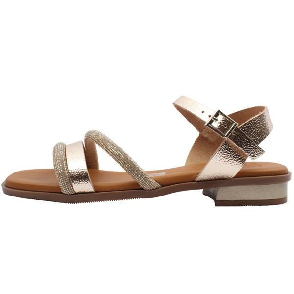 Gold sandal with a strap on a white background