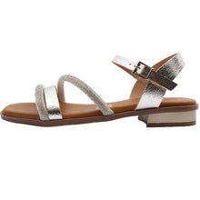 Load image into Gallery viewer, Silver strappy sandal with a brown sole on a white background
