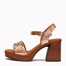 Load image into Gallery viewer, gold high-heeled sandal with metallic strap on a white background
