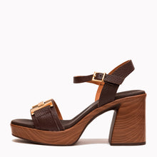 Load image into Gallery viewer, Brown high-heeled sandal with gold buckle on a white background
