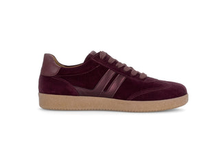 Maroon sneaker with a brown sole on a white background