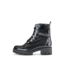Load image into Gallery viewer, Black leather boot with white laces on a white background
