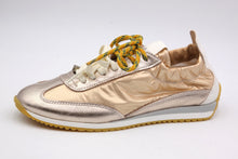 Load image into Gallery viewer, Gold sneaker with white sole on a light gray background
