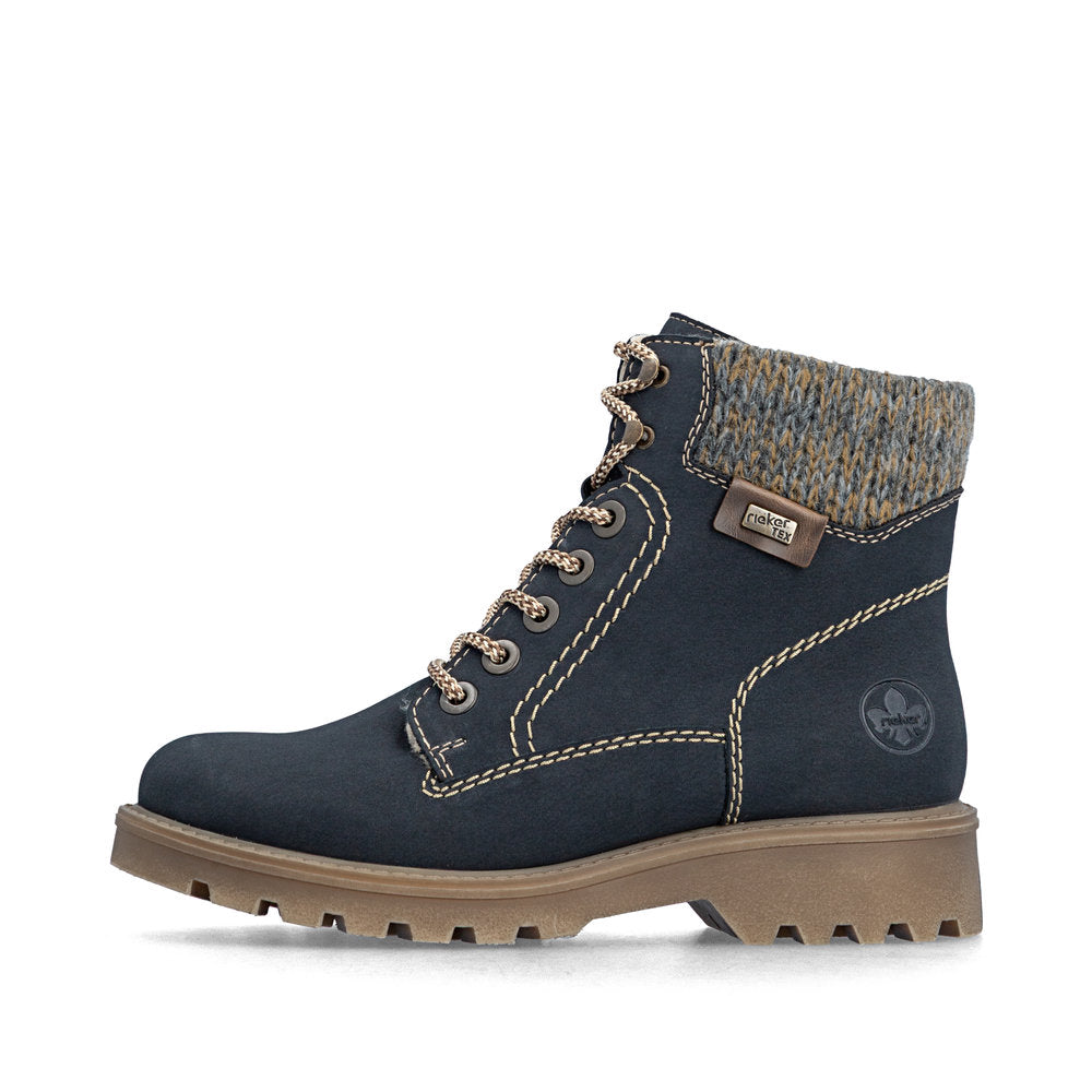 Navy blue boot with brown sole on a white background