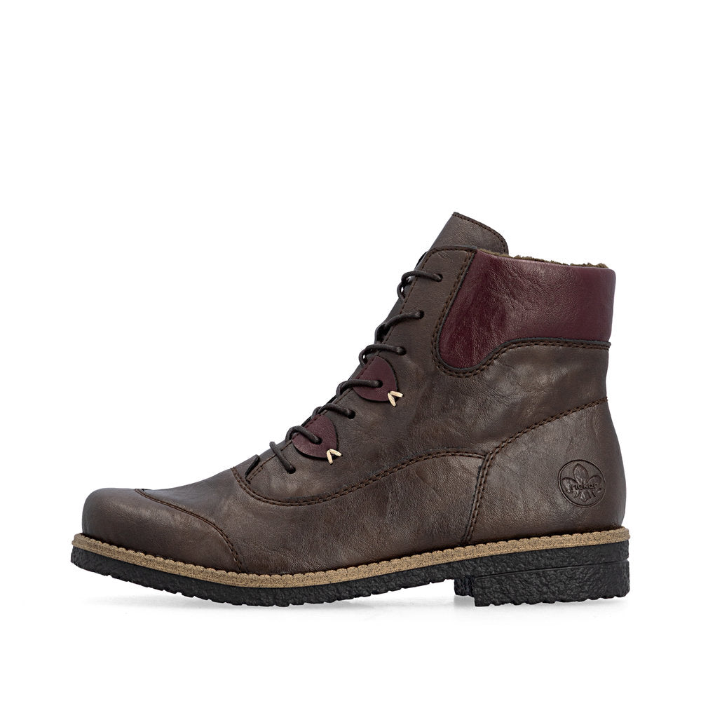 Brown leather boot with maroon lining on a white background