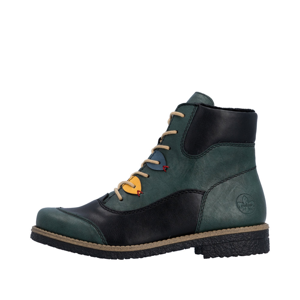 Green and black leather boot with colorful accents on a white background