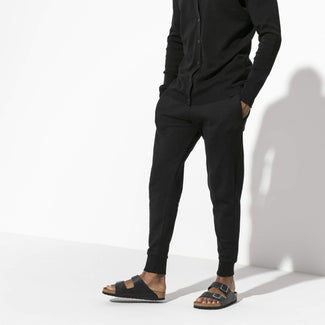 Black sandal with cork insole on a white background