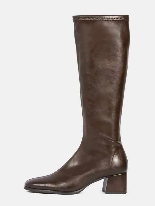 A dark brown leather knee-high boot with a low block heel and square toe, shown in profile against a light gray background.
