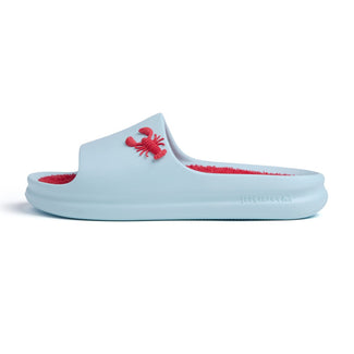 Light blue slide sandal with red interior and crab design on a white background