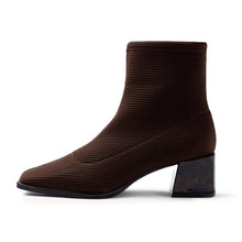 Load image into Gallery viewer, A dark brown ankle boot with a ribbed, textured fabric upper and a chunky block heel, shown in profile against a white background.
