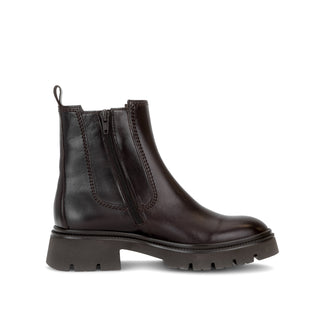 Brown leather Chelsea boot on a white background