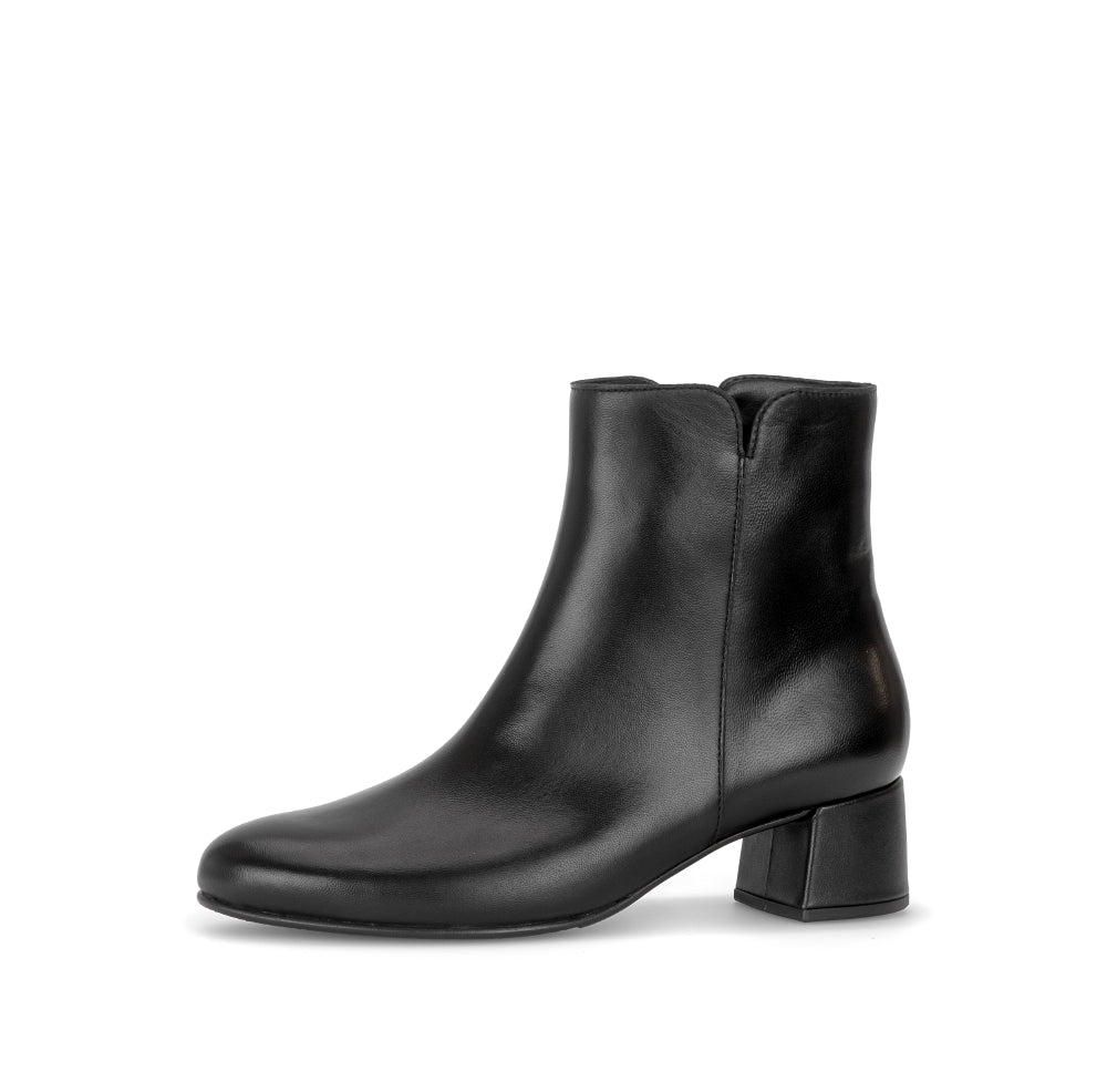 Black ankle boot on a white background