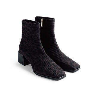 Black lace-up boot on a white background