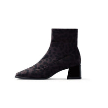 Load image into Gallery viewer, Black lace-up boot on a white background
