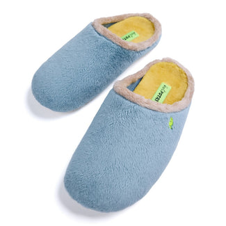 A single light blue plush slipper with a beige faux-fur lining and a small green embroidered logo on the side, shown against a plain white background.