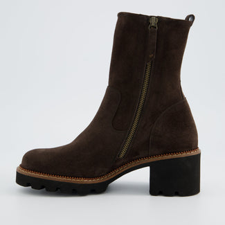 Brown suede boot with a chunky sole on a light gray background