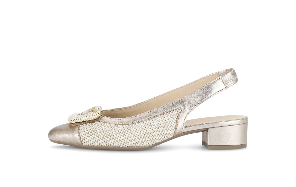 Silver slingback shoe with a decorative bow on a white background