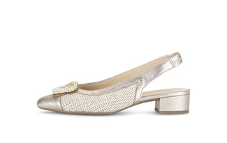 Silver slingback shoe with a decorative bow on a white background