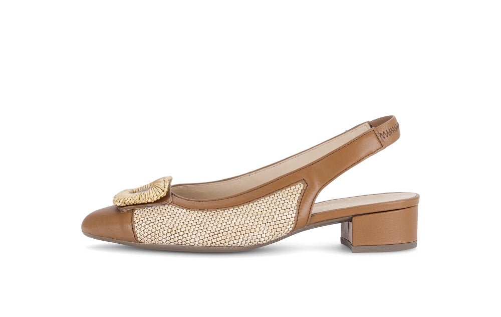 Beige sandal with decorative bow on a white background
