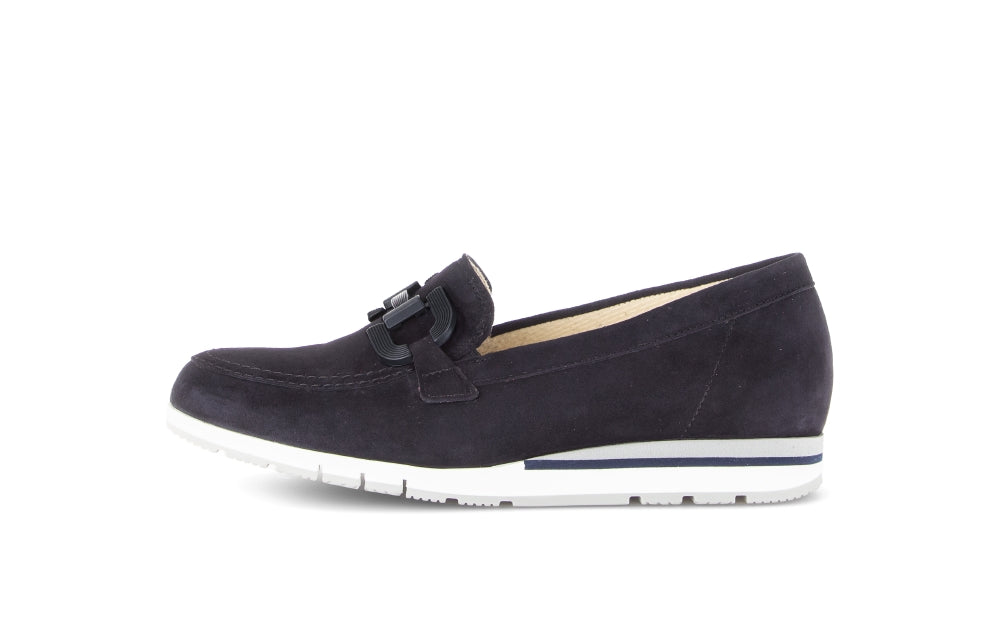 Navy loafer shoe on a white background