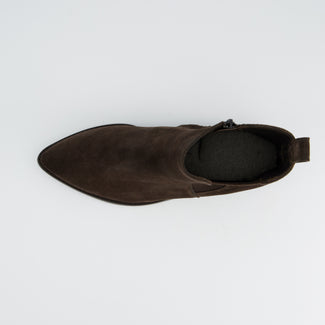 Brown suede ankle boot on a light gray background