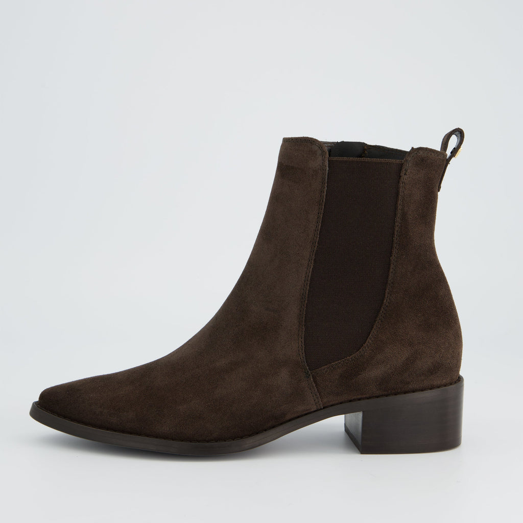 Brown suede ankle boot on a light gray background