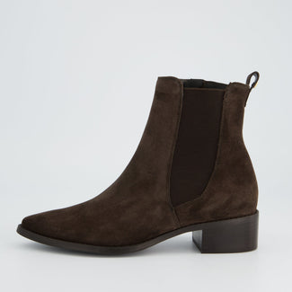 Brown suede ankle boot on a light gray background