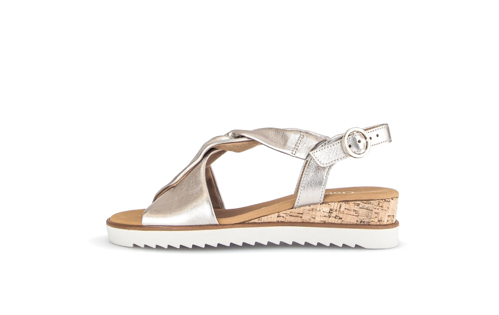 Silver sandal with cork sole on a white background
