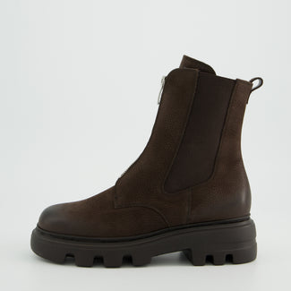 Brown leather boot with a thick sole on a light gray background