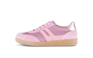 Pink sneaker with metallic accents on a white background