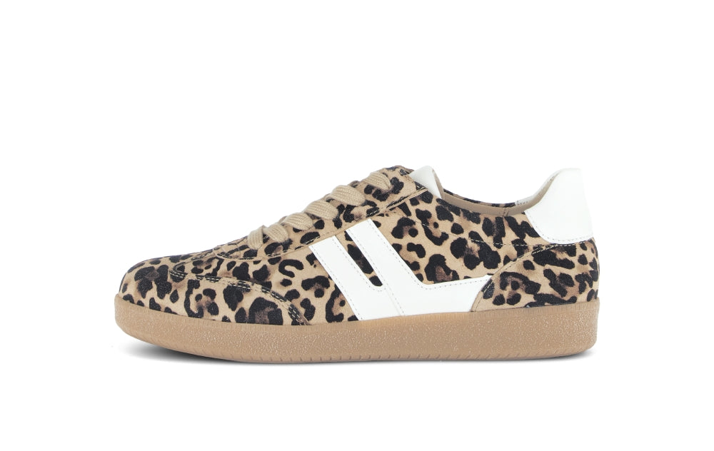 Sneaker with leopard print pattern and white stripes on a beige sole.