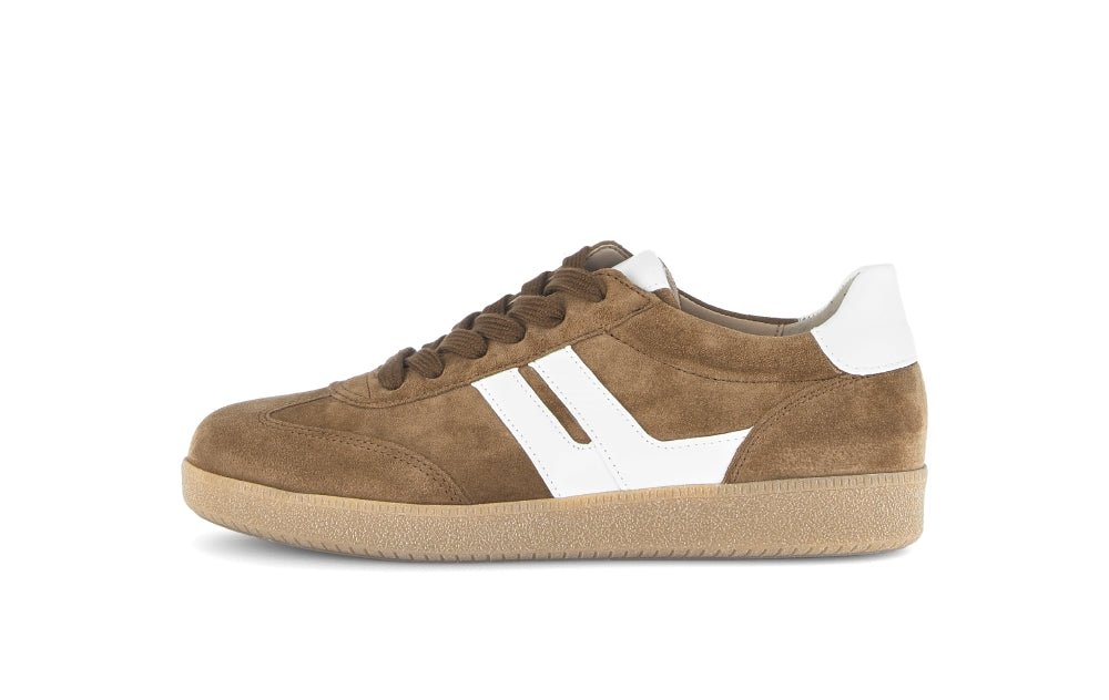 Brown sneaker with white accents on a white background