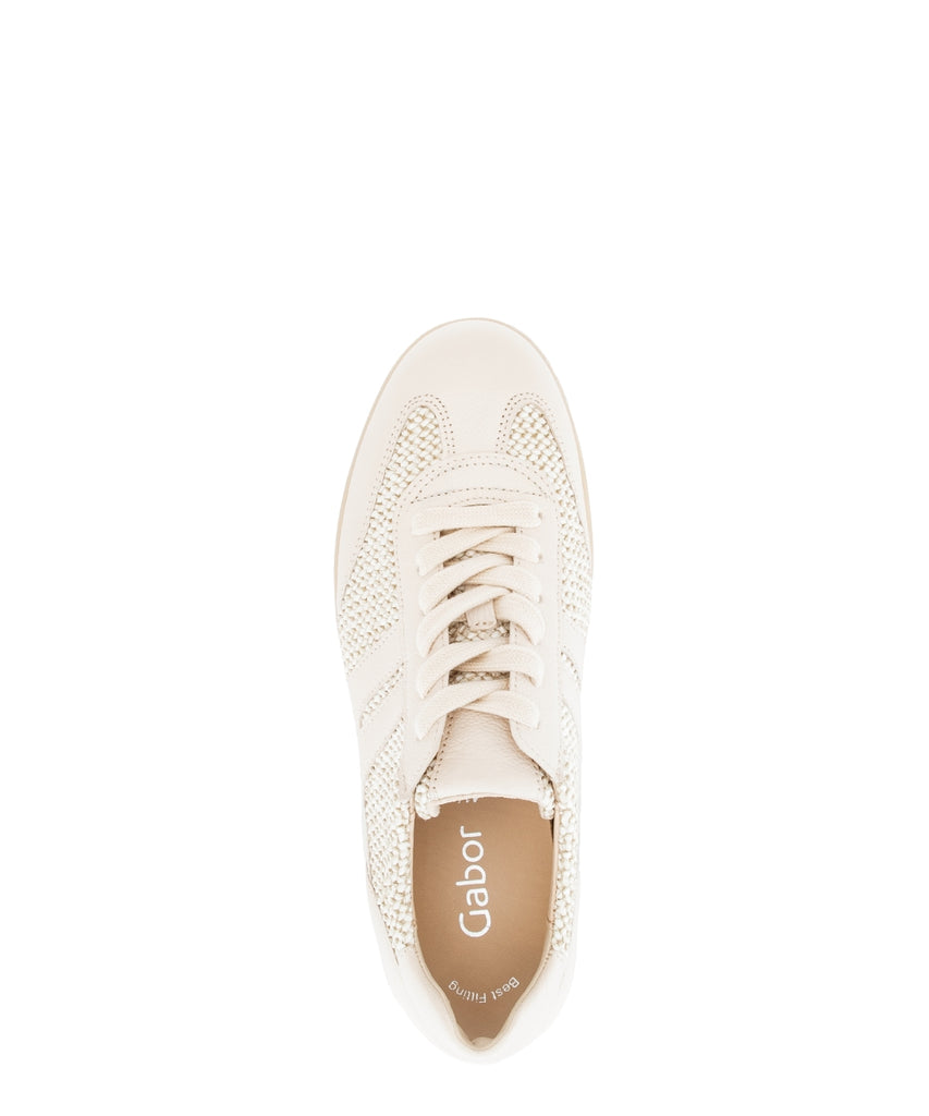 White sneaker with lace-up design on a white background